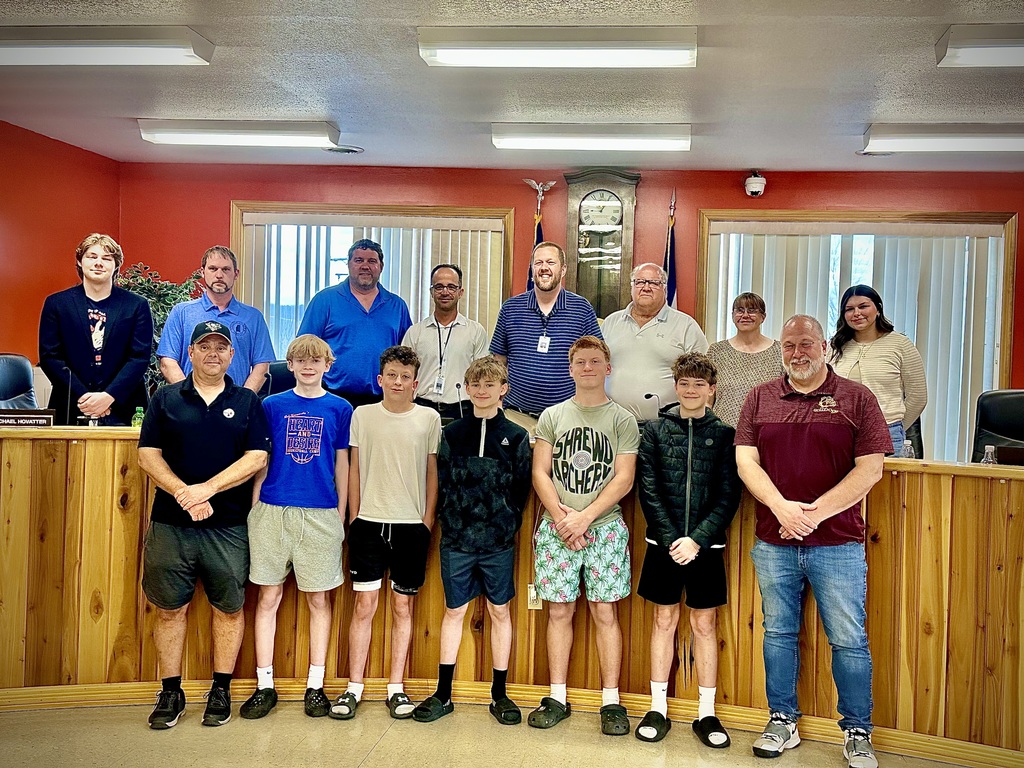 students pose with board members to be recognized