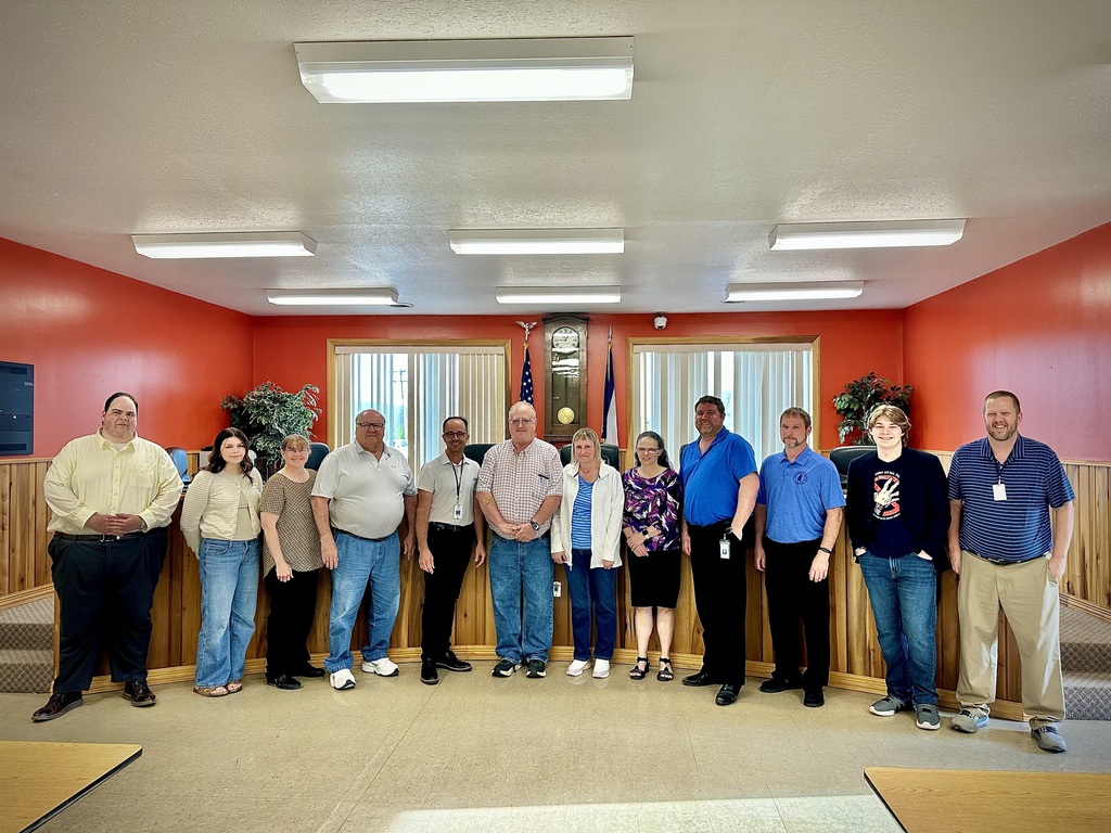 students pose with board members to be recognized