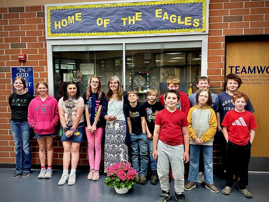 students pose with board members to be recognized for achievement
