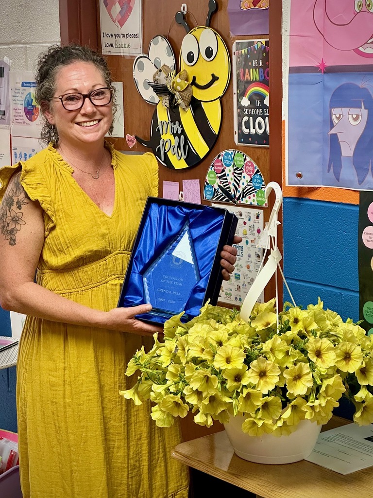 students pose with board members to be recognized for achievement