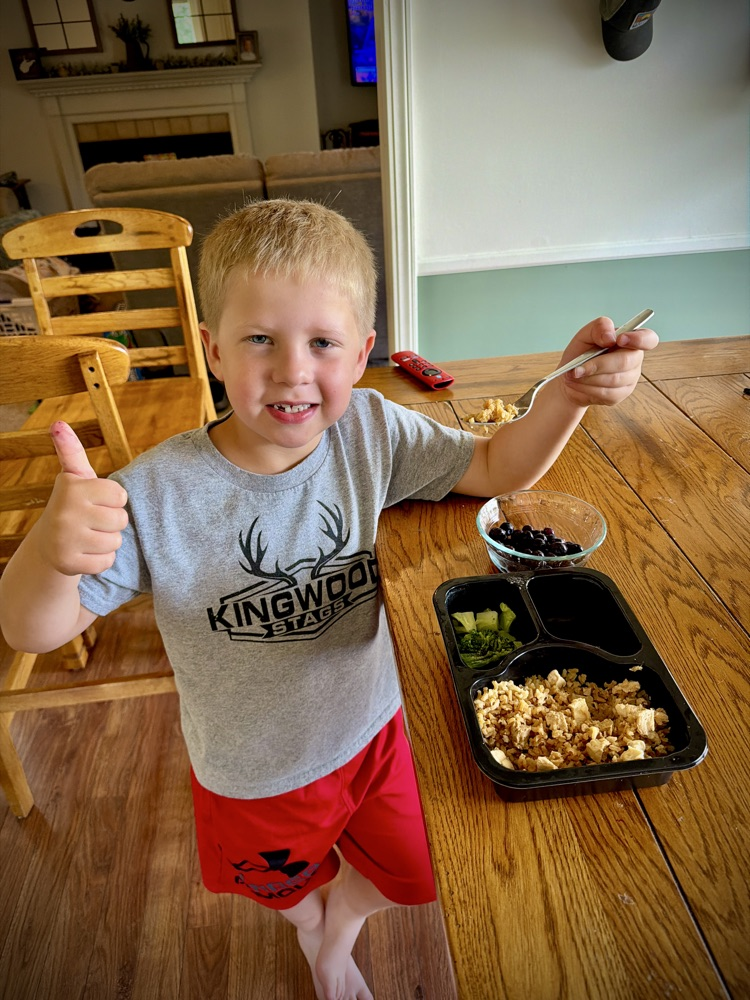 kid enjoying a lunch