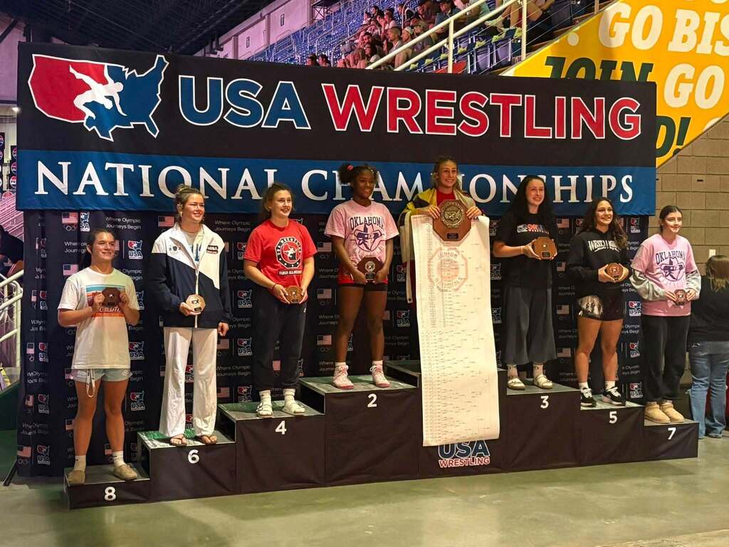 female wrestlers on winners podium who placed at nationals