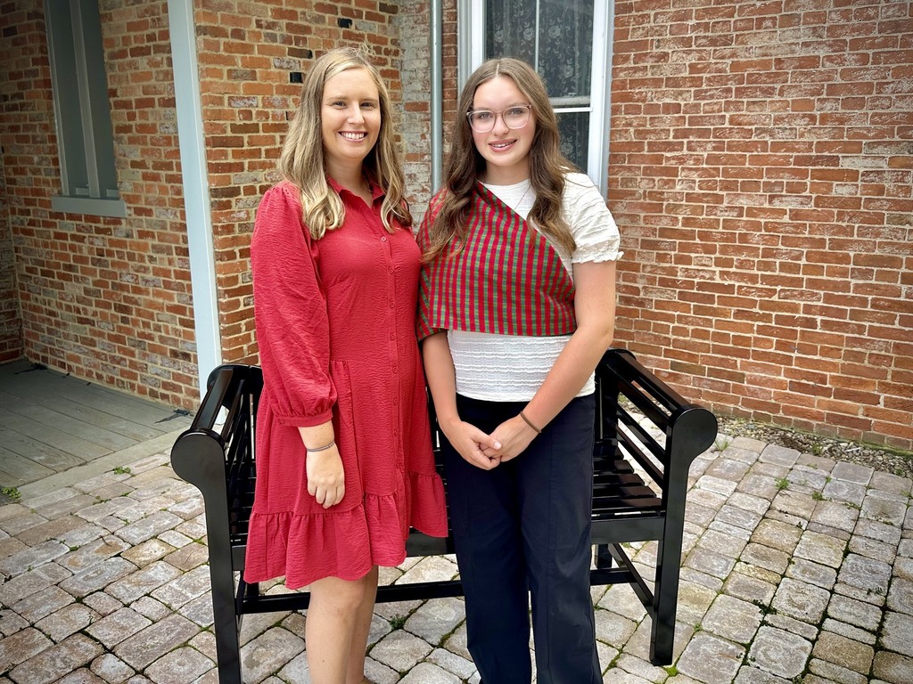 students pose with adults after receiving an award
