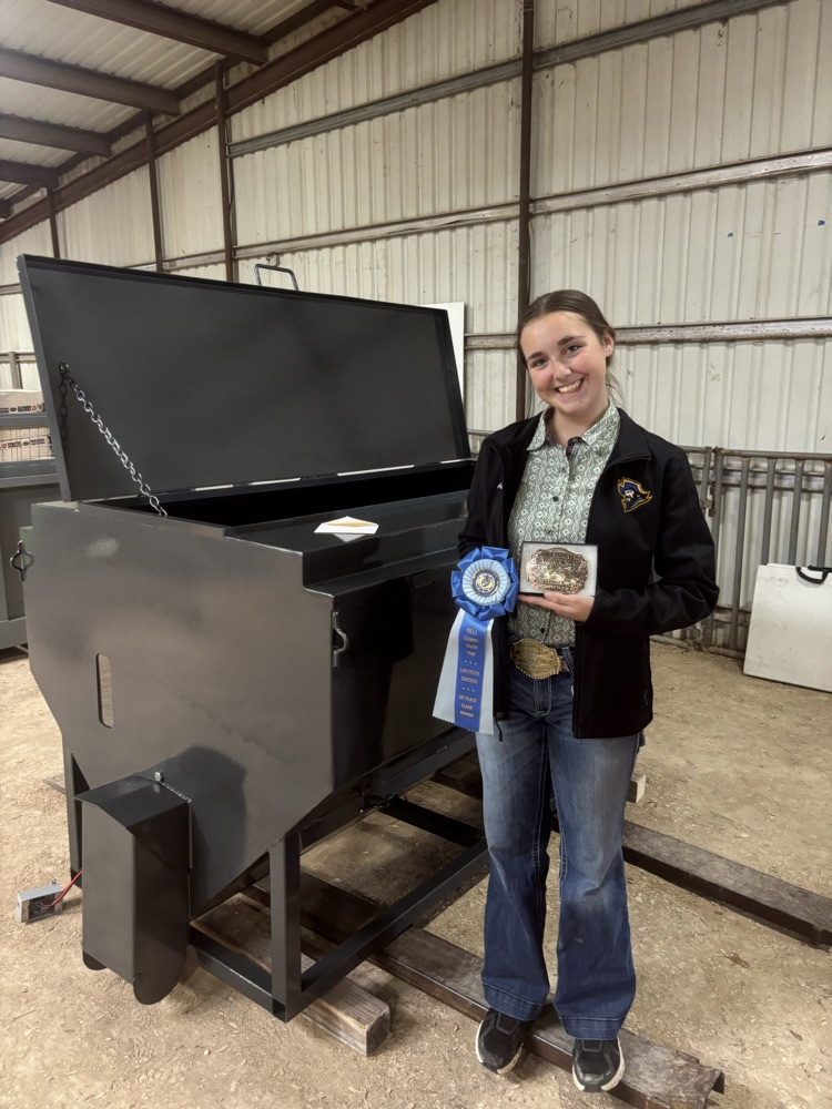 Addie posing with her feeder 