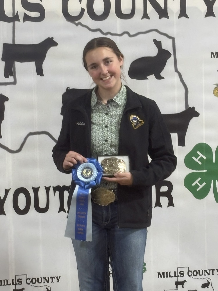 Addie standing at the backdrop 