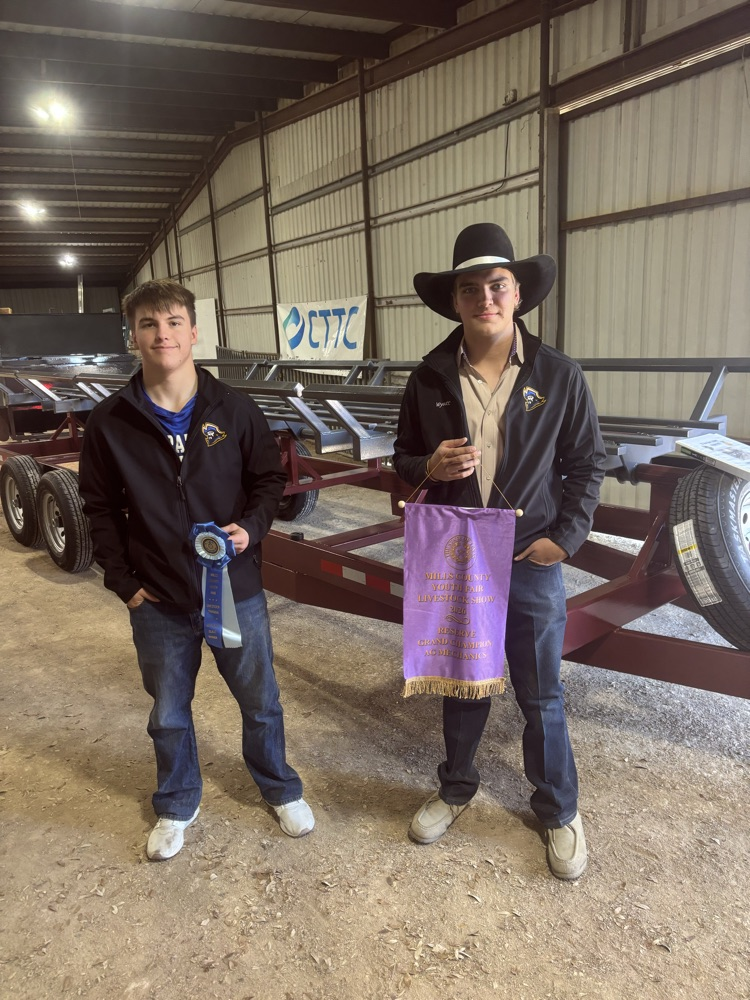 Shane and Wyatt with their hay trailer 