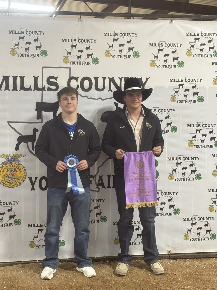 Shane and Wyatt standing at the backdrop 