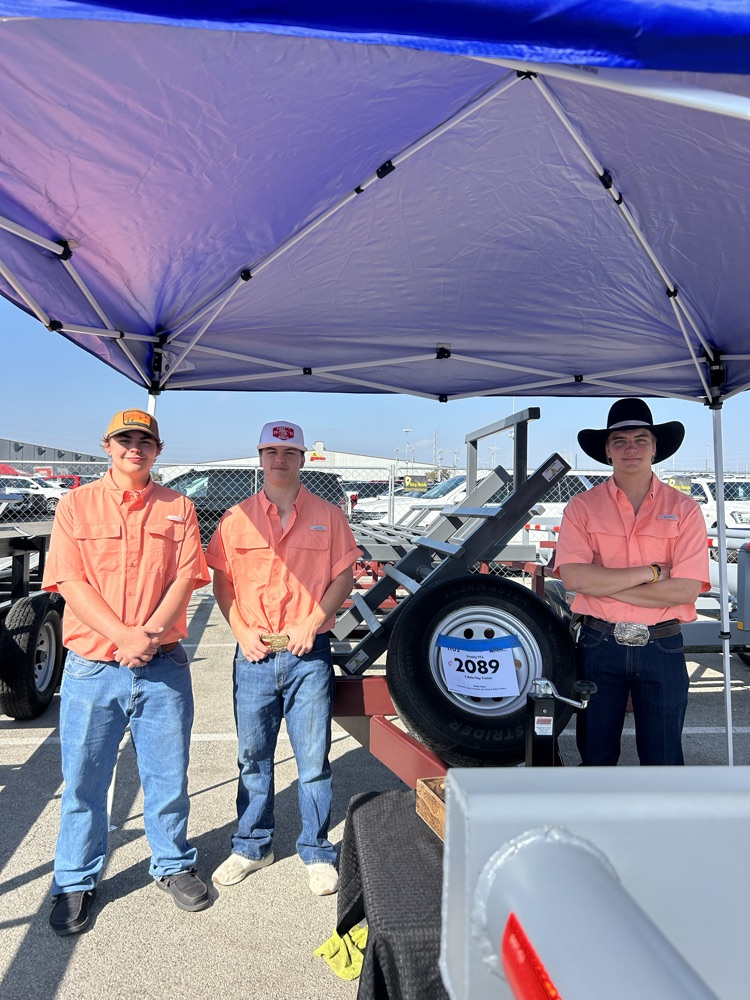 Wyatt, Matthew, and Shane with their hay trailer.