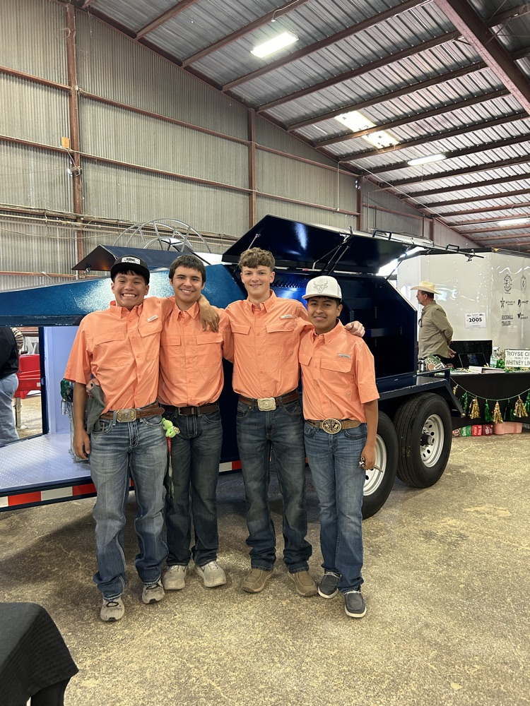 Diego, Luis, Brailen, and Jaxon with their fuel trailer.