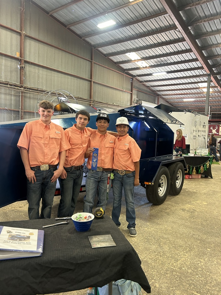Brailen, Jaxon, Luis, and Diego with their blue ribbon