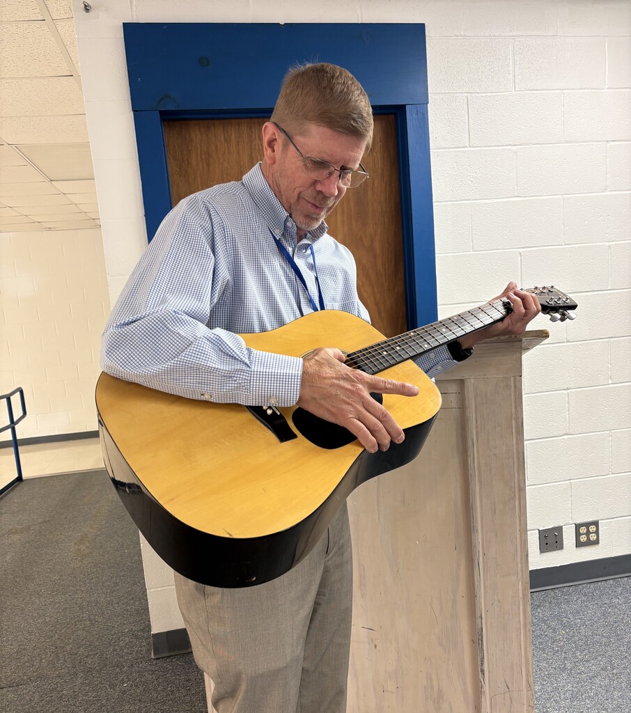 Mr. Coker learning a new song!