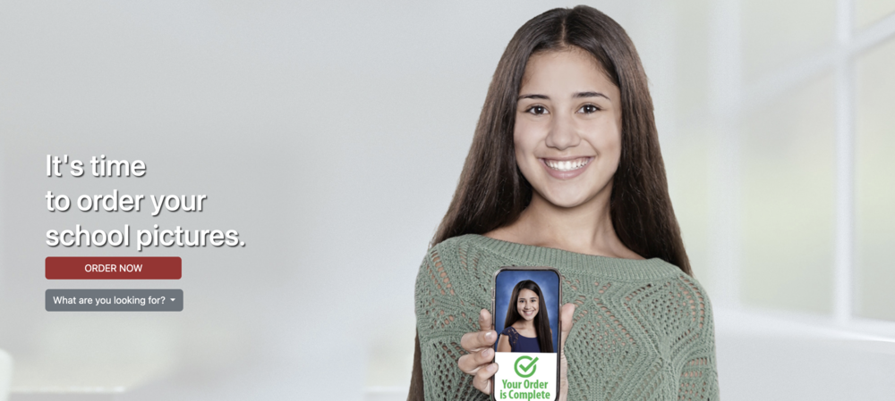 Girl holding photo showing that her picture order is complete. https://www.barksdalephoto.com/