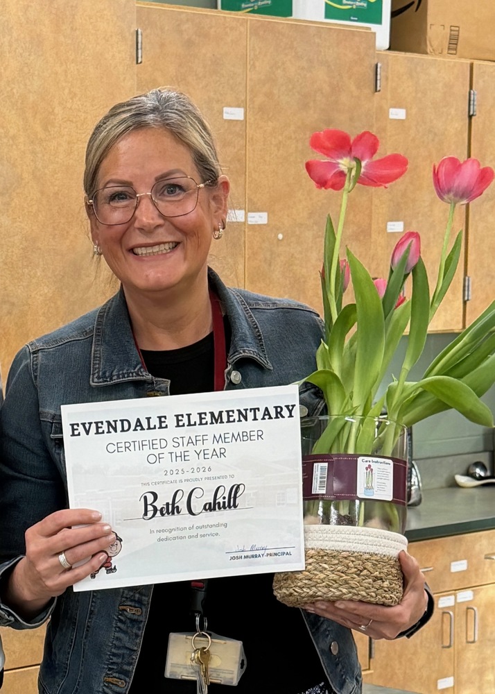 person that is holding a flower and holding a piece of paper