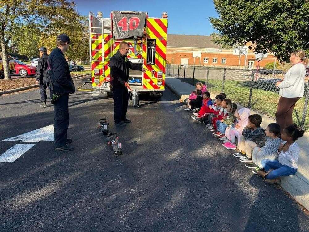 Evendale Firefighters teaching preschool students about fire safety.