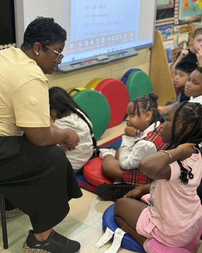 Heritage Hill Teacher gives lesson to students in classroom on First Day of School