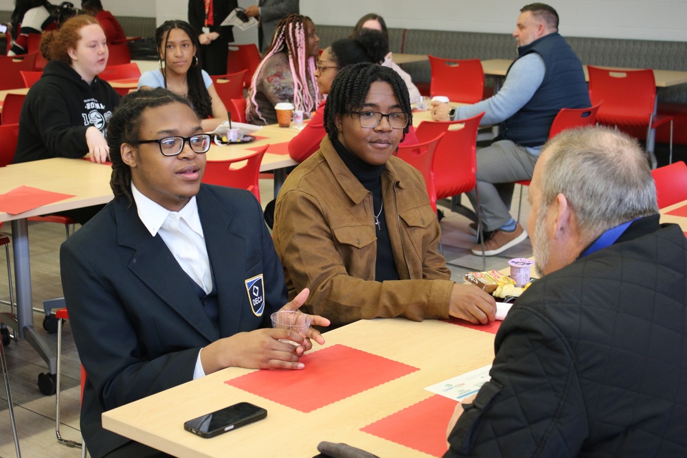 Two Princeton students talking to a community partner during a past Business and Community Partner Breakfast