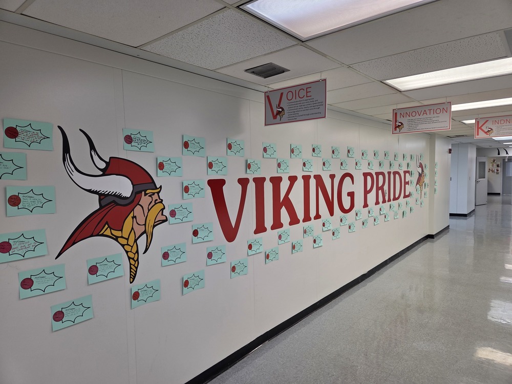 Viking Pride wall at the Innovation Center with the Viking head logo and random notes of kindness all around it
