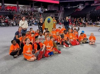 students wearing orange shirts 