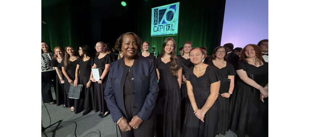 Mary Cleveland and members of A Cappella on the stage at OSBA.