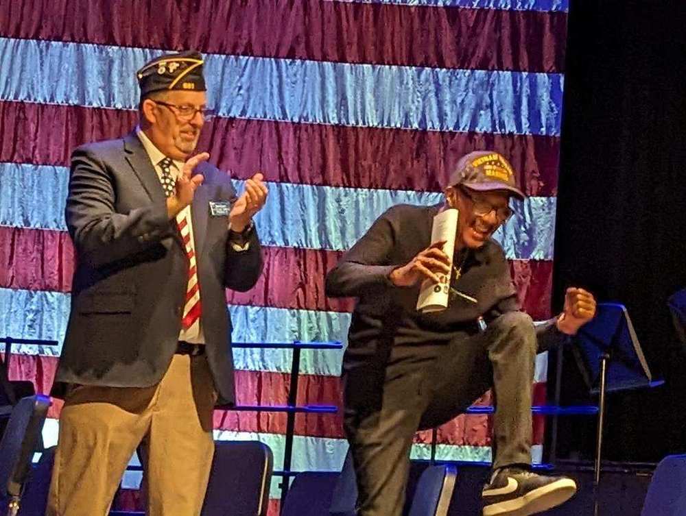 Veteran jumps for joy as he receives his high school diploma from Princeton High School.