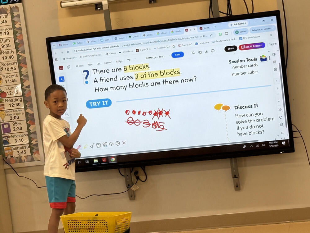 1st grade student at Lincoln Heights loves using the Clevertouch to show of his math skills.
