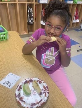 student eating an apple