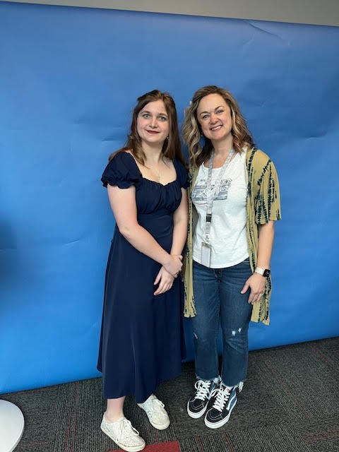 Photo of student with teacher