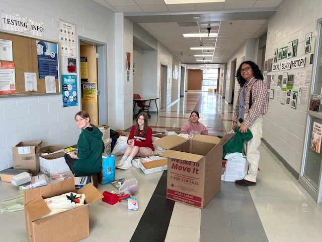 IB Students collecting school supplies