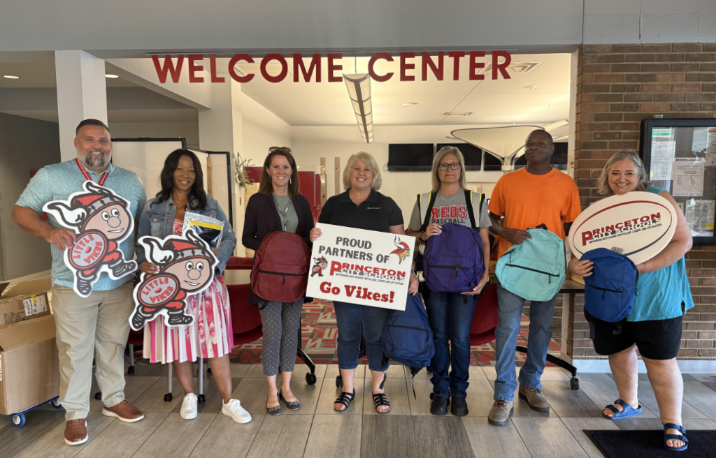 Shorr Packaging staff with Dr. Ronald Fausnaugh, Mrs. LaDora Hill, Mrs. Kim Melzer, and district media specialist, Amy Price as they deliver backpacks to the Welcome Center.