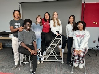 2025-2026 IB Full Diploma Candidates photo of students on steps and stools