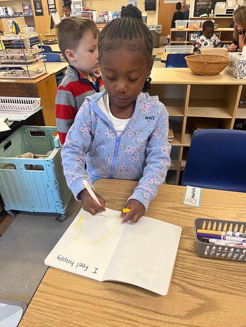Pre K friends writing.