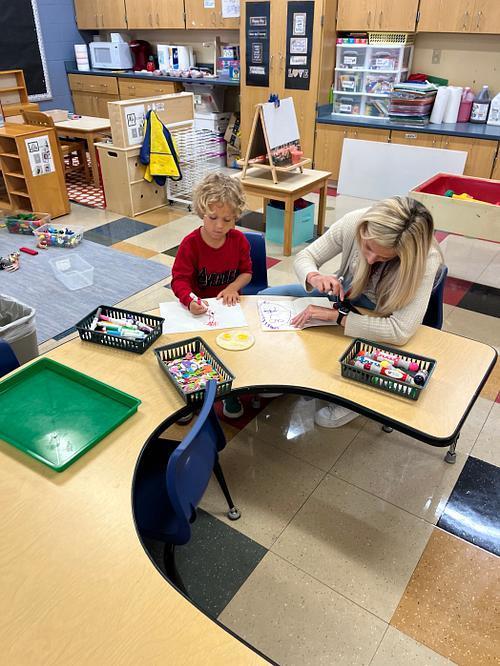 Pre K working with grown ups.