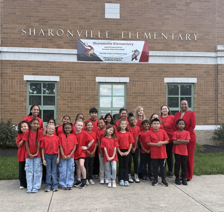 Lighthouse Student Leaders and staff from Sharonville Elementary pose outside under Sharonville sign