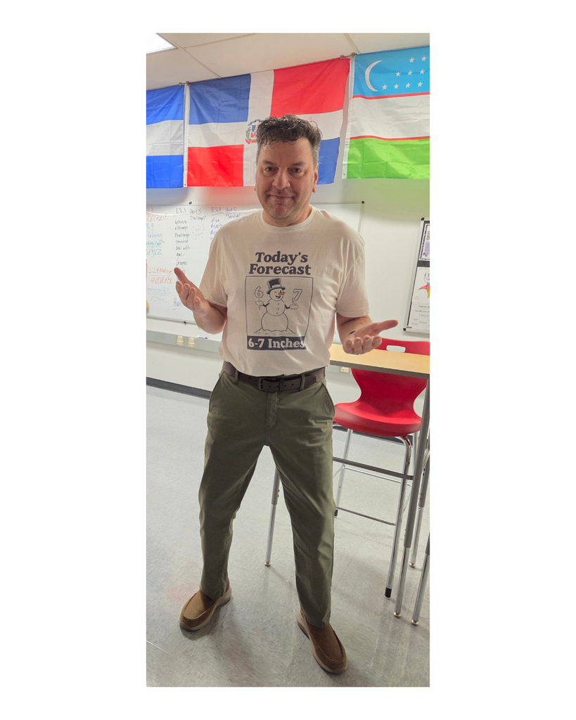 Mr. Spence in a snowman shirt that says Today's Forecast 6-7 inches