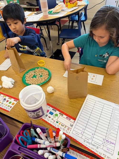 students making a 100 day snack mix