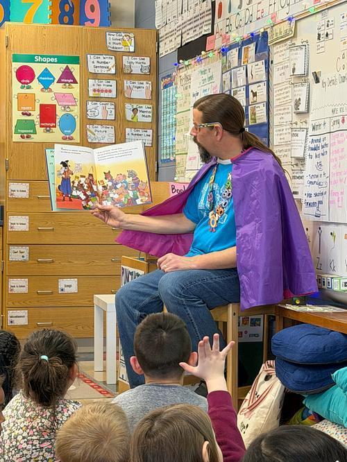 Zero th e hero reading a book to the kindergarten classes #EV