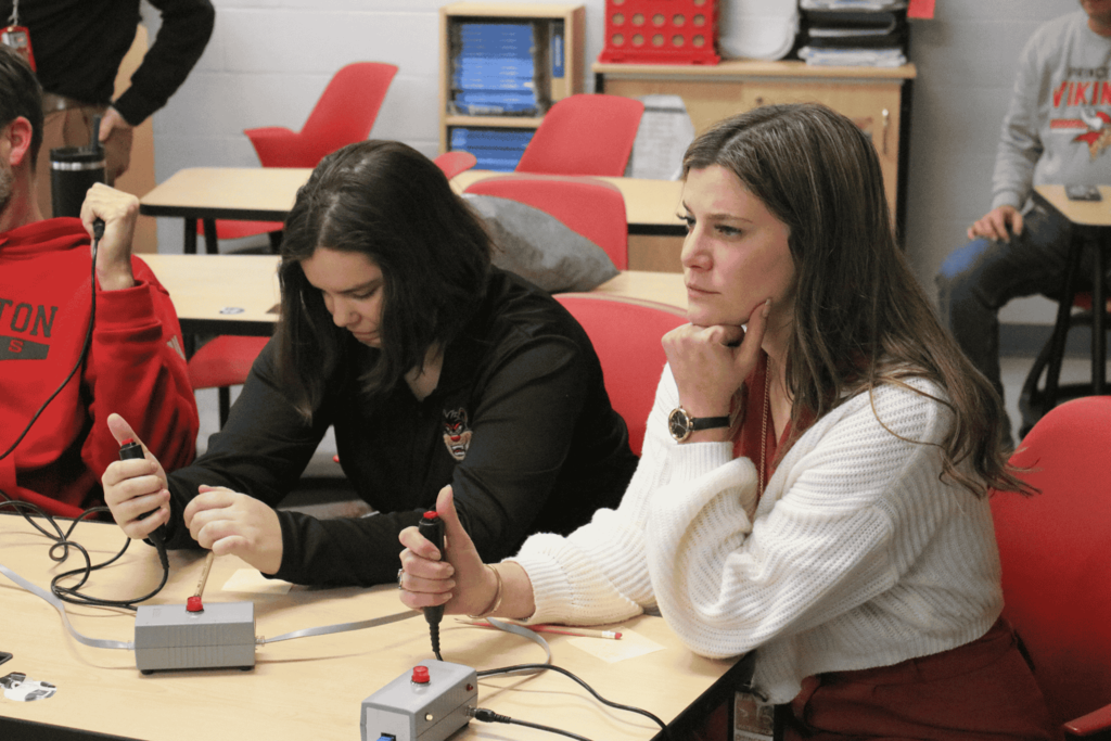 Teachers looking puzzled while thinking of the answer