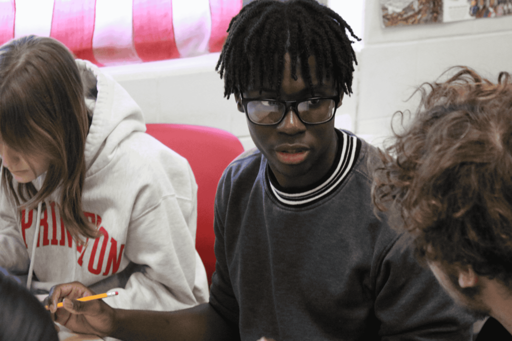 Students discussing during the single-letter challenge