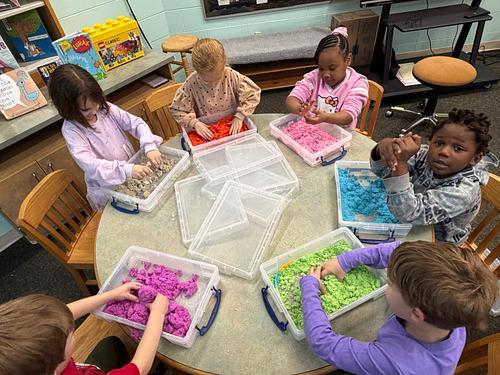 #EV students exploring with kinetic sand in library