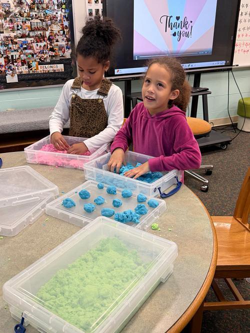 #EV students exploring with kinetic sand in library