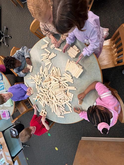 #EV students exploring with wooden blocks in library