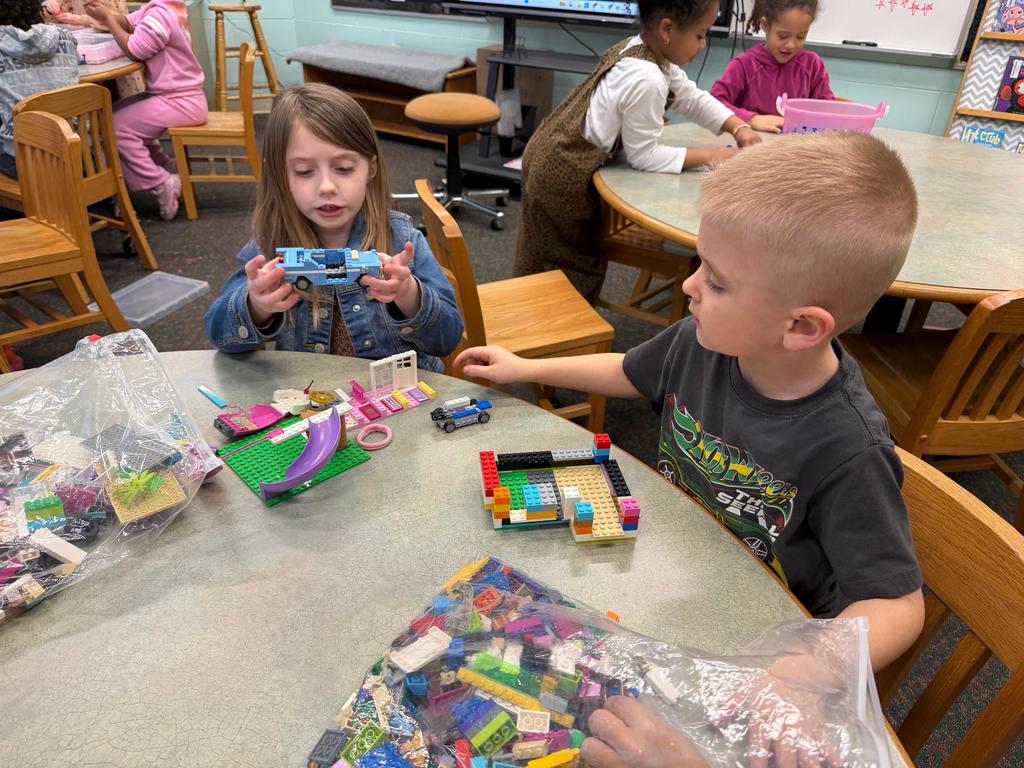 #EV students exploring with plastic brick pieces in library