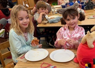 students eating pizza in a classroom