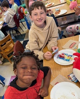 students eating pizza in a classroom