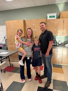 people holding flowers and awards 