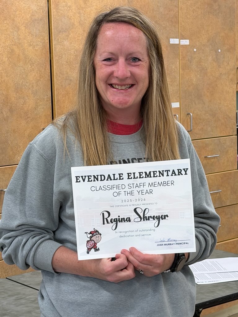 people holding flowers and awards 