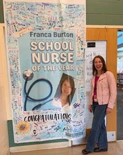 person standing in front of a banner