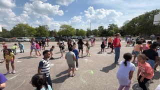 students on the playground dancing 