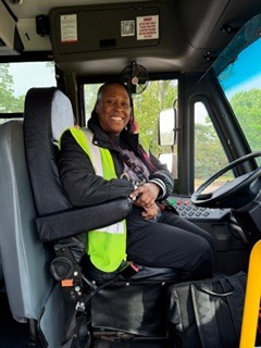person sitting in a bus seat 