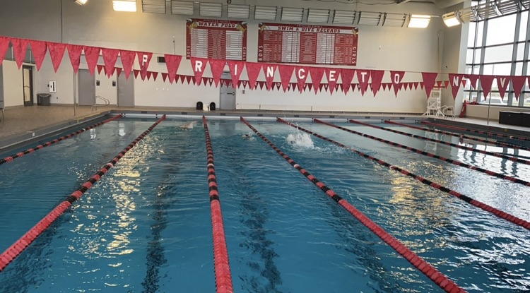 Princeton pool with red lane lines and backstroke flags that spell out out P R I N C E T O N.